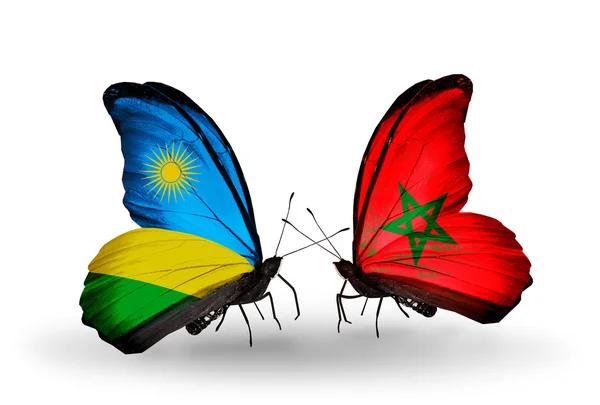 Borboletas com bandeira de Ruanda e Marrocos — Fotografia de Stock