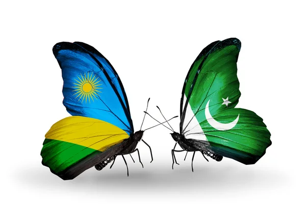 Butterflies with Rwanda and  Pakistan flag — Stock Photo, Image