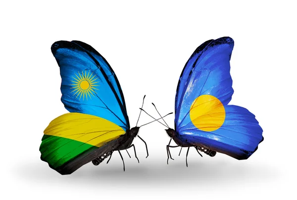 Butterflies with Rwanda and Palau flag — Stock Photo, Image