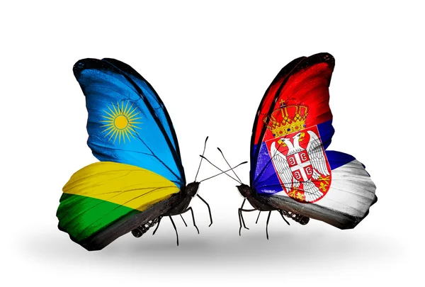 Butterflies with Rwanda and Serbia flags — Stock Photo, Image