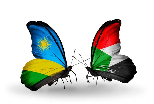 Butterflies with  Rwanda and Sudan flags — Stock Photo, Image