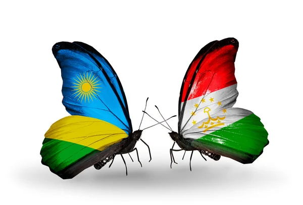 Mariposas con banderas de Ruanda y Tayikistán — Foto de Stock