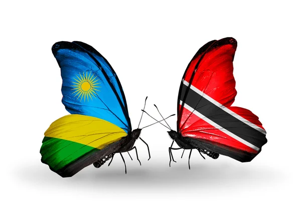 Butterflies with  Rwanda and Trinidad and Tobago flags — Stock Photo, Image