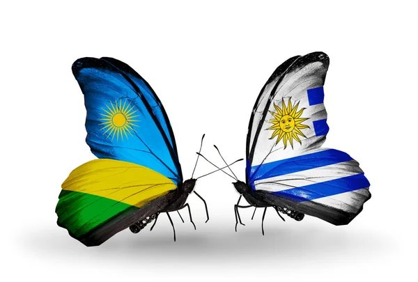 Butterflies with Rwanda and Uruguay flags — Stock Photo, Image