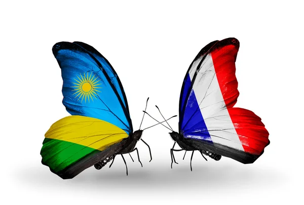 Butterflies with Rwanda and France flags — Stock Photo, Image