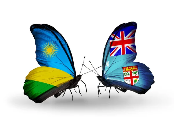 Бабочки с флагами Руанды и Фиджи — стоковое фото