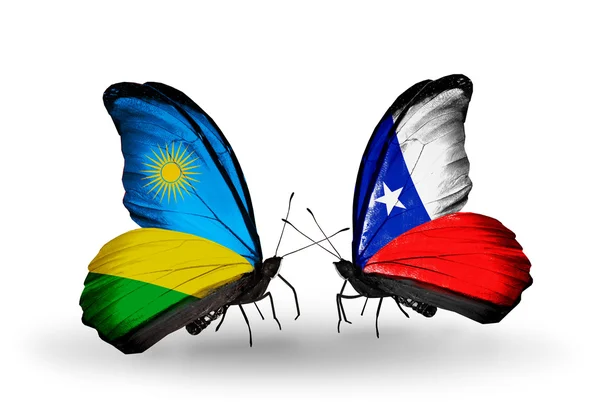 Farfalle con bandiere Ruanda e Cile — Foto Stock