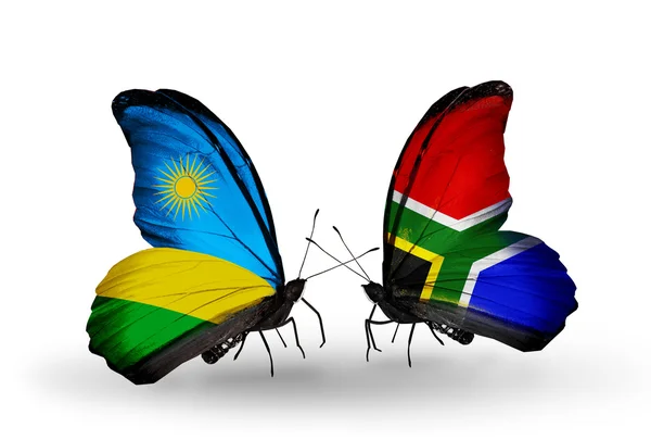 Butterflies with Rwanda and South Africa flags — Stock Photo, Image