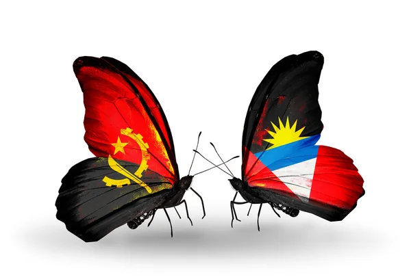 Butterflies with Angola and Antigua and Barbuda flags — Stock Photo, Image