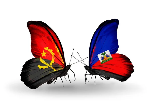 Butterflies with Angola and Haiti flags — Stock Photo, Image