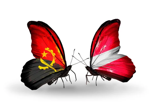 Butterflies with Angola and Latvia flags — Stock Photo, Image