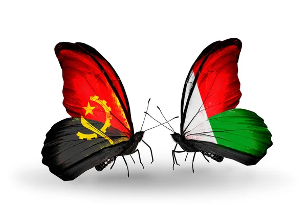 Kelebekler Angola ve Madagaskar bayrağı ile — Stok fotoğraf