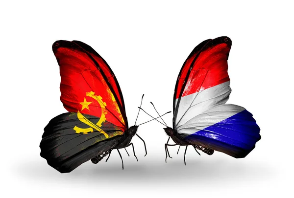 Butterflies with Angola and Holland flags — Stock Photo, Image