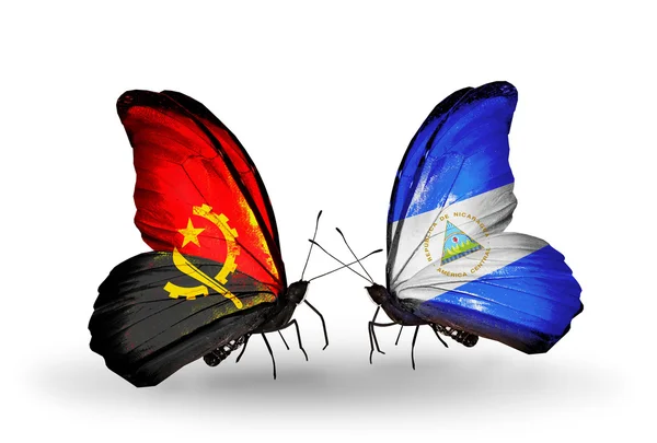 Butterflies with Angola and Holland flags — Stock Photo, Image