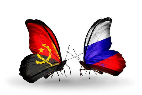 Butterflies with Angola and Russia flags — Stock Photo, Image