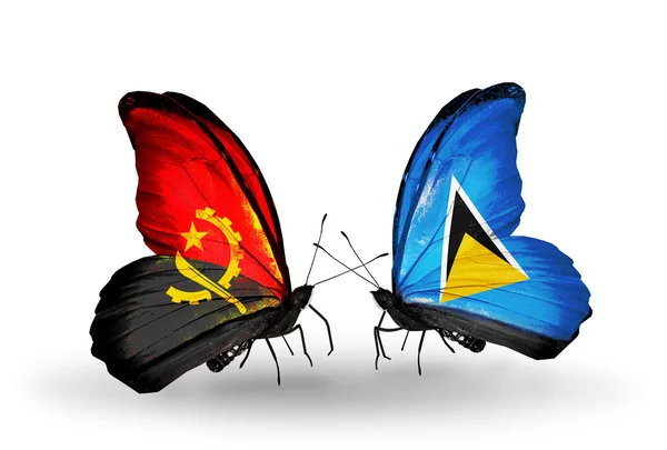 Butterflies with Angola and Saint Lucia flags — Stock Photo, Image