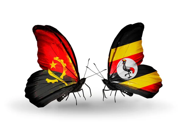 Farfalle con bandiere Angola e Uganda — Foto Stock