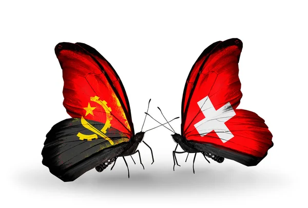Vlinders met Angola en Zwitserland vlaggen — Stockfoto