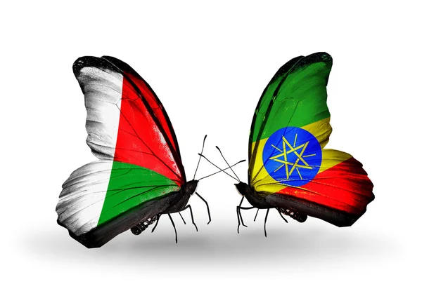 Butterflies with Madagascar and Ethiopia flags — Stock Photo, Image