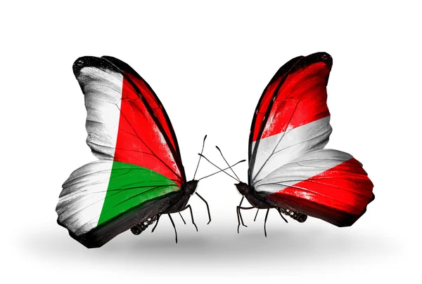 Butterflies with  Madagascar and Austria flags — Stock Photo, Image
