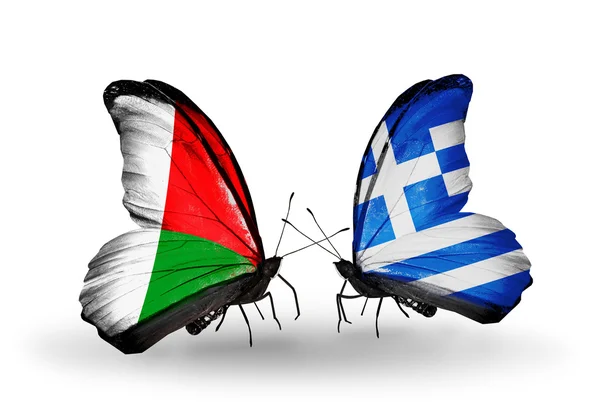 Butterflies with Madagascar and Greece flags — Stock Photo, Image