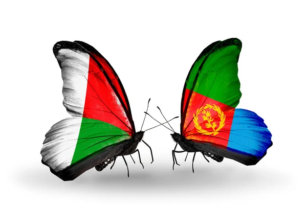Butterflies with Madagascar and Eritrea flags — Stock Photo, Image