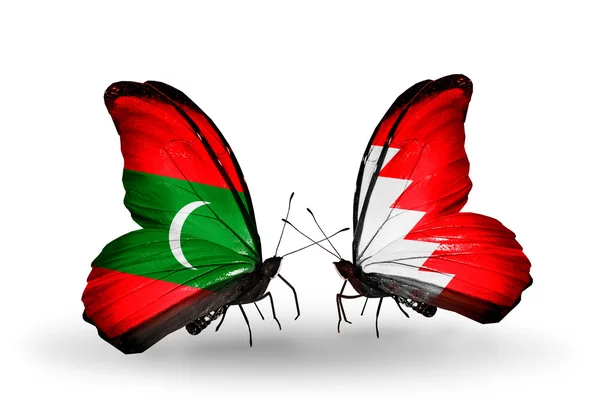 蝴蝶与马尔代夫和巴林国旗 — 图库照片