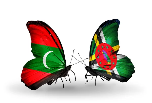 Butterflies with Maldives and Dominica flags — Stock Photo, Image