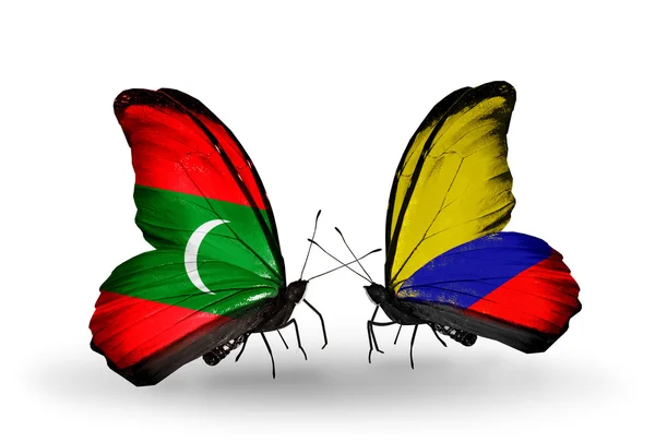 Бабочки с Мальдивскими и Колумбийскими флагами — стоковое фото