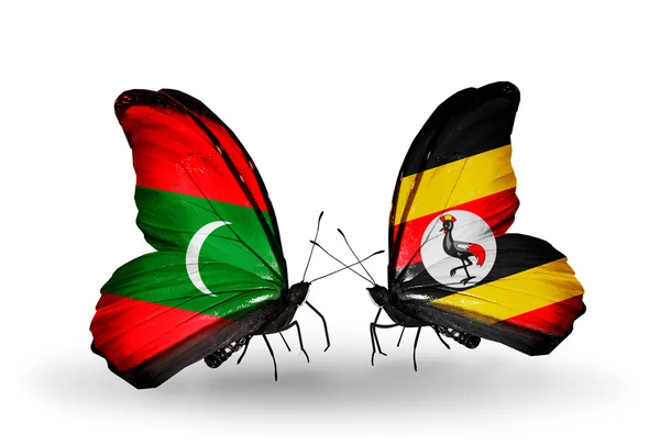 Butterflies with Maldives and Uganda flags — Stock Photo, Image