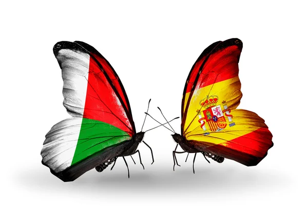 Papillons avec drapeaux Madagascar et Espagne — Photo