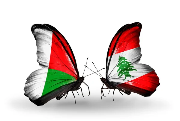 Butterflies with Madagascar and Lebanon flags — Stock Photo, Image