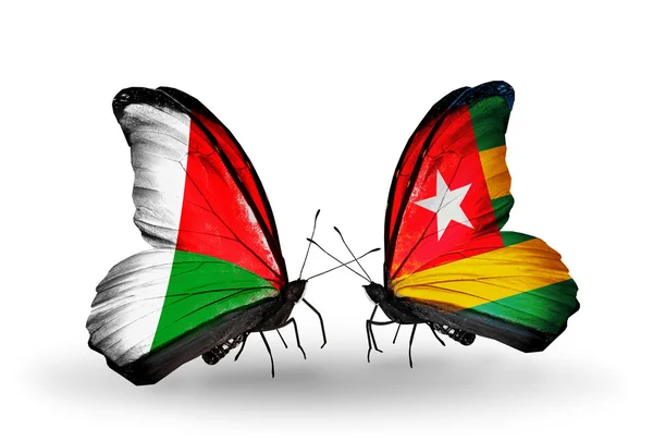 Butterflies with Madagascar and Togo flags — Stock Photo, Image