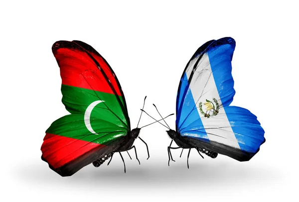 蝴蝶与马尔代夫和危地马拉的国旗 — 图库照片