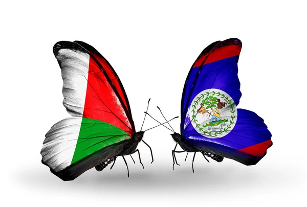 Farfalle con bandiere Madagascar e Belize — Foto Stock