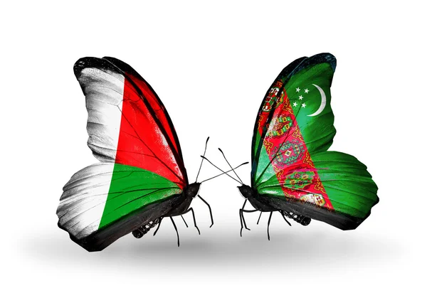 Butterflies with Madagascar and Turkmenistan flags — Stock Photo, Image