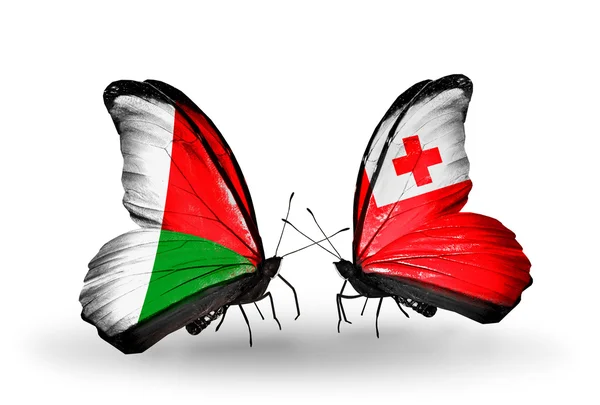 Motyle z Madagaskaru i Tonga flagi — Zdjęcie stockowe