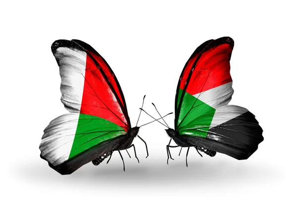Πεταλούδες με τη Μαδαγασκάρη και τη Σιέρα Λεόνε σημαίες — Φωτογραφία Αρχείου