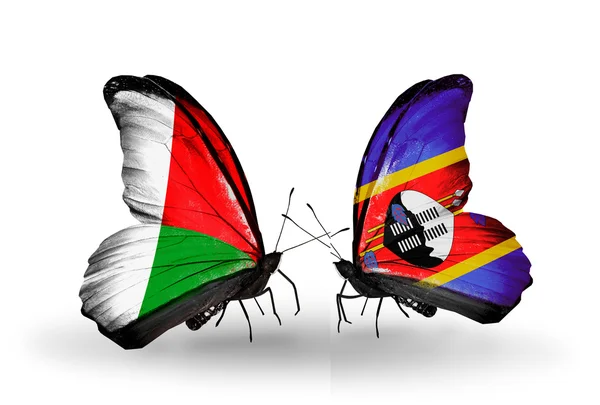Mariposas con banderas de Madagascar y Swazilandia —  Fotos de Stock