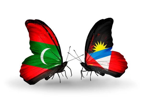 Butterflies with Maldives and Antigua and Barbuda flags — Stock Photo, Image