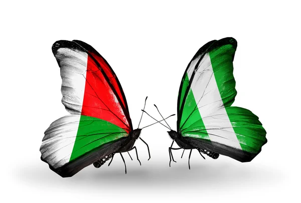 蝴蝶与马达加斯加和尼日利亚国旗 — 图库照片