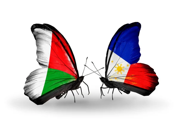 Butterflies with Madagascar and Philippines flags — Stock Photo, Image