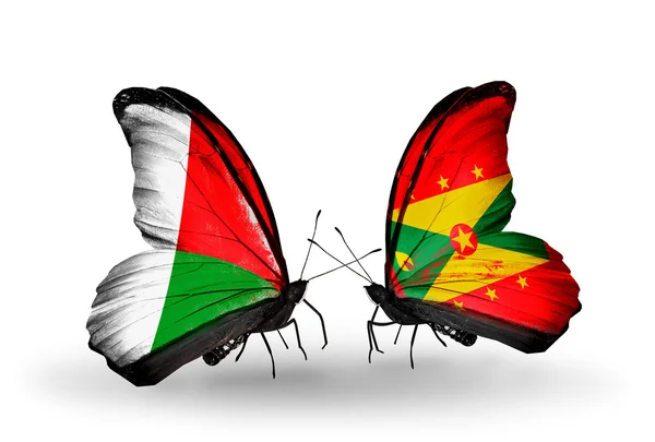 Butterflies with Madagascar and Grenada flags — Stock Photo, Image