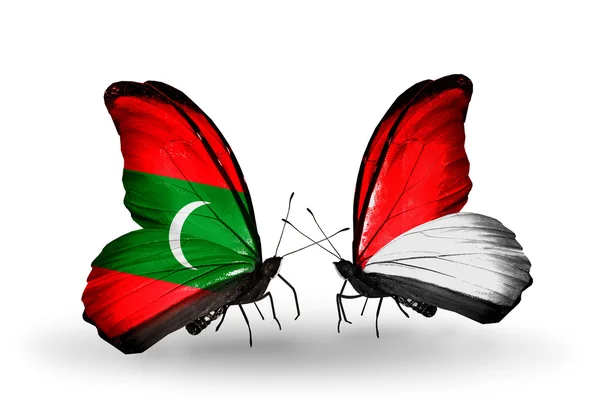 Butterflies with  Maldives and Monaco, Indonesia flags — Stock Photo, Image