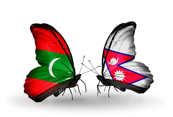 Butterflies with Maldives and Nepal flags — Stock Photo, Image