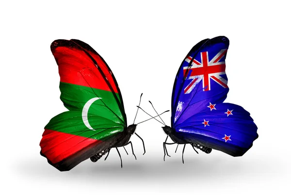 Butterflies with Maldives and New Zealand flags — Stock Photo, Image