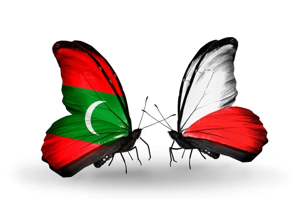 Butterflies with Maldives and Poland flags — Stock Photo, Image