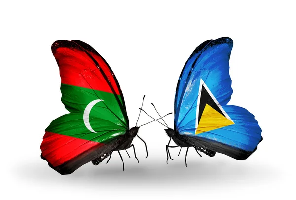 Butterflies with Maldives and Saint Lucia flags — Stock Photo, Image