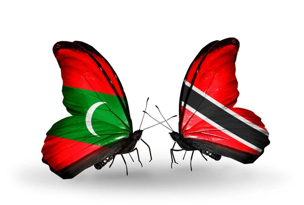 Motyle z flagami Malediwy i Trynidadu i Tobago — Zdjęcie stockowe