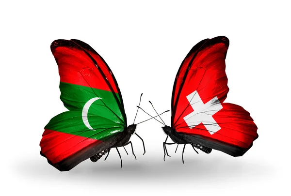 Borboletas com bandeiras Maldivas e Suíça — Fotografia de Stock